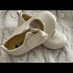 Dainty white crib shoes